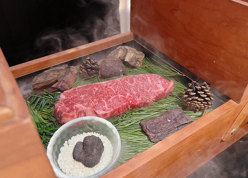 WOOARA Gwanghwamun · the signature Hanwoo showing — marbled beef cuts and caviar presented in a display chest