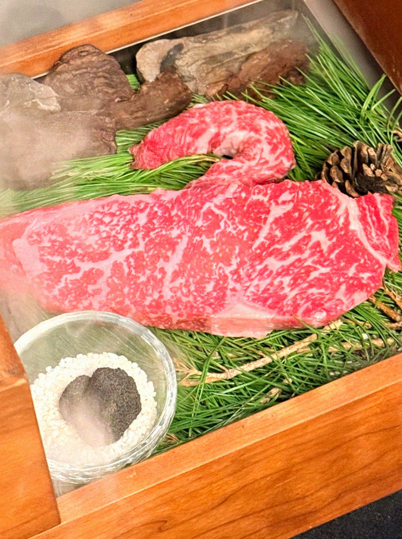 WOOARA Gwanghwamun · the signature Hanwoo showing — marbled beef cuts and caviar presented in a display chest