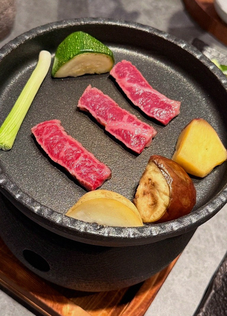 WOOHANA Yeouido · the signature Hanwoo showing — marbled beef cuts and caviar presented in a display chest
