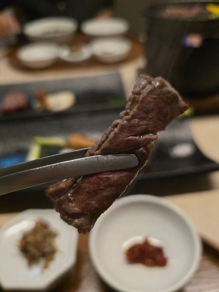 WOOARA Gwanghwamun · premium marbled Hanwoo beef presented before grilling