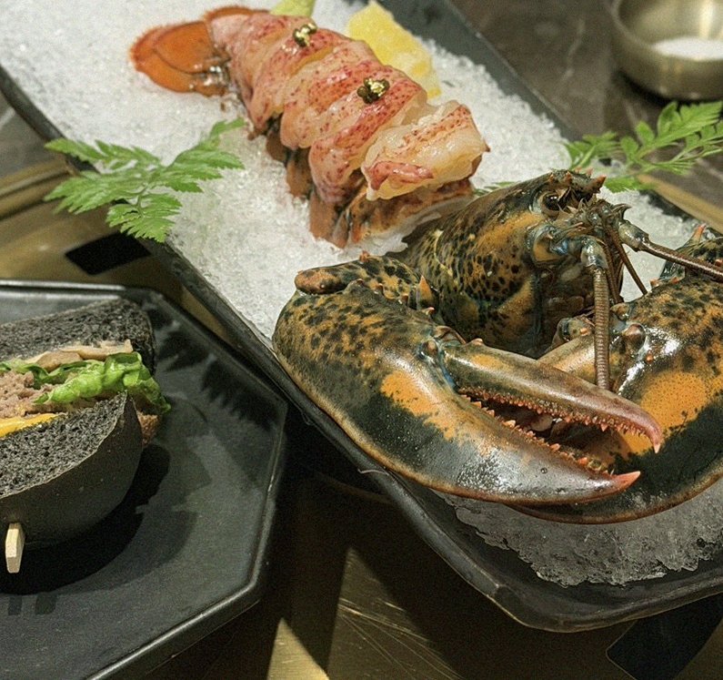 DAEBOJUNG City Hall · the signature Hanwoo showing — marbled beef cuts and caviar presented in a display chest