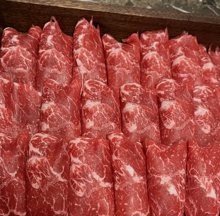 DAEBOJUNG City Hall · premium marbled Hanwoo beef presented before grilling