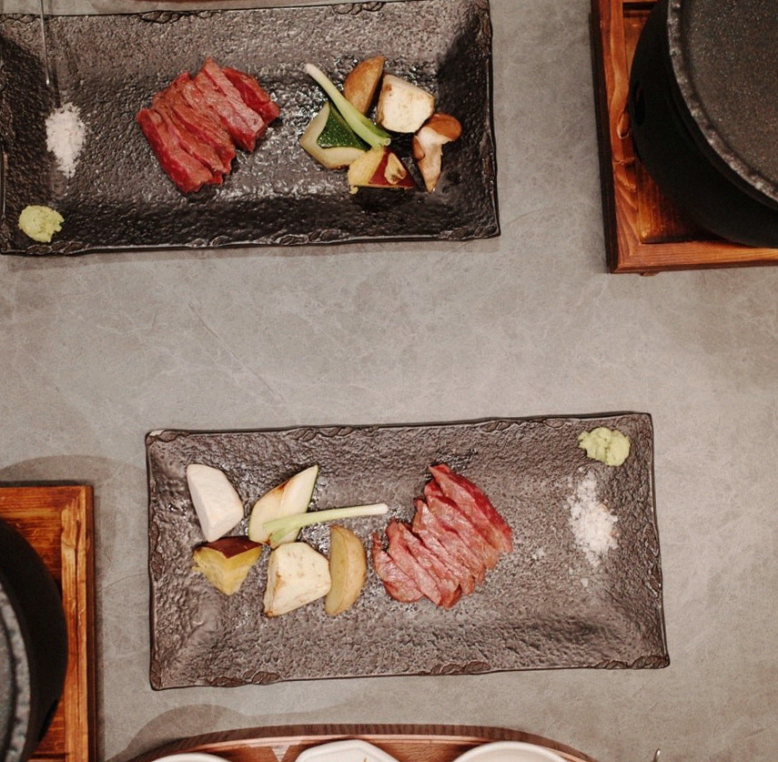 WOOHANA Yeouido · the signature Hanwoo showing — marbled beef cuts and caviar presented in a display chest