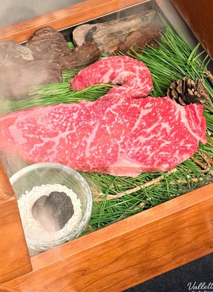 WOOARA Yeouido · the signature Hanwoo showing — marbled beef cuts and caviar presented in a display chest