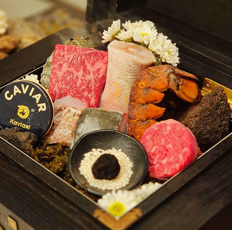 GOWOOGA Gwanghwamun · the signature Hanwoo showing — marbled beef cuts and caviar presented in a display chest
