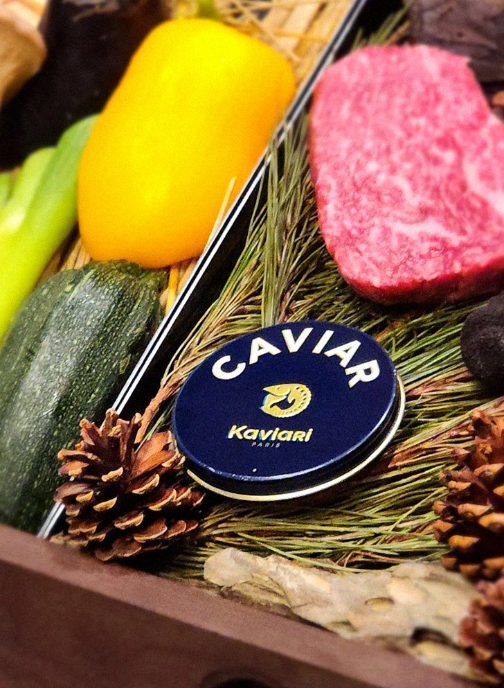 WOOHANA Yeouido · the signature Hanwoo showing — marbled beef cuts and caviar presented in a display chest