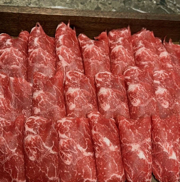 DAEBOJUNG Yeouido · premium marbled Hanwoo beef presented before grilling