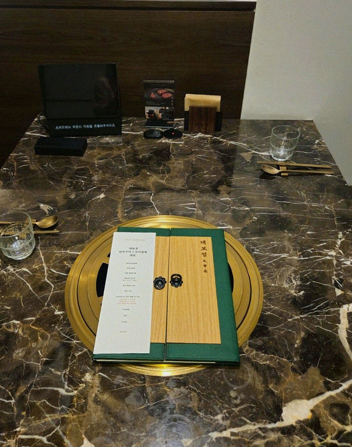 DAEBOJUNG City Hall · the signature Hanwoo showing — marbled beef cuts and caviar presented in a display chest