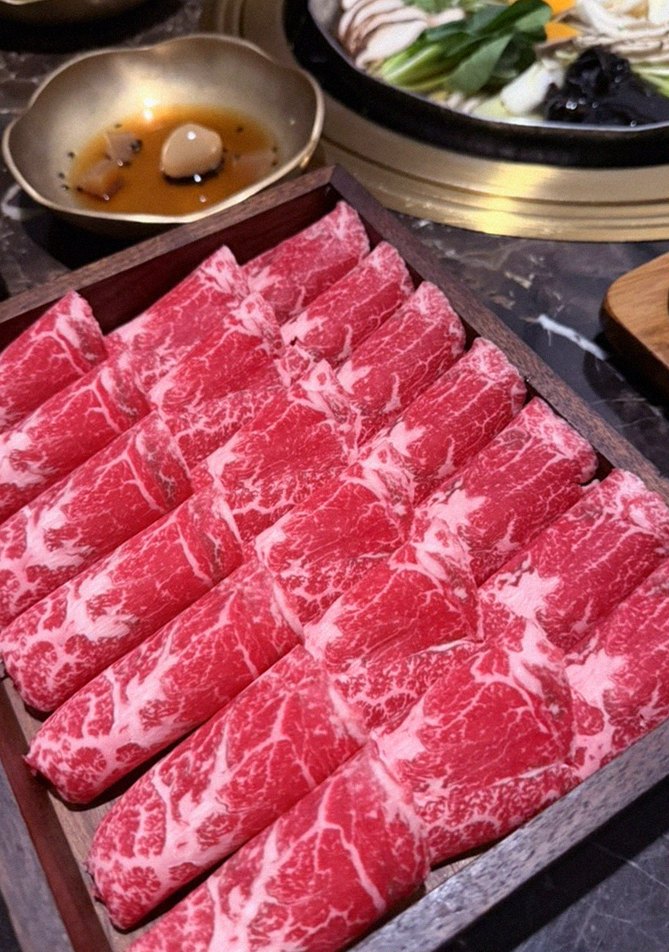 DAEBOJUNG City Hall · premium marbled Hanwoo beef presented before grilling