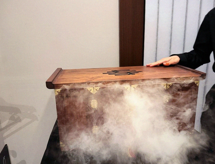 WOOHANA Yeouido · the signature Hanwoo showing — marbled beef cuts and caviar presented in a display chest