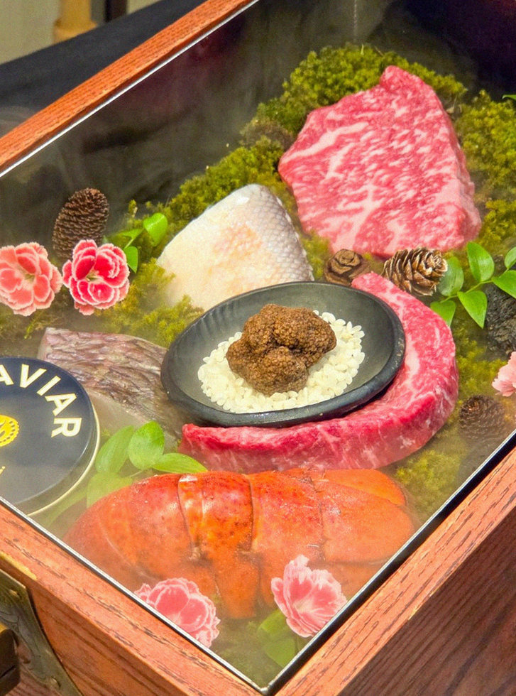 GOWOOGA Yeouido · the signature Hanwoo showing — marbled beef cuts and caviar presented in a display chest