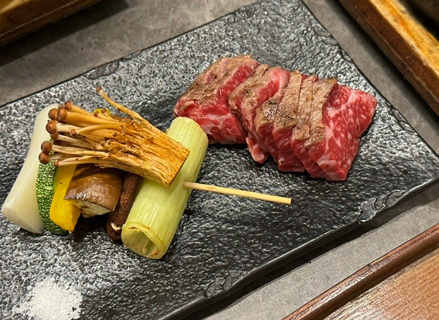 GOWOOGA Gwanghwamun · the signature Hanwoo showing — marbled beef cuts and caviar presented in a display chest