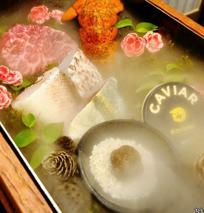 GOWOOGA Yeouido · the signature Hanwoo showing — marbled beef cuts and caviar presented in a display chest