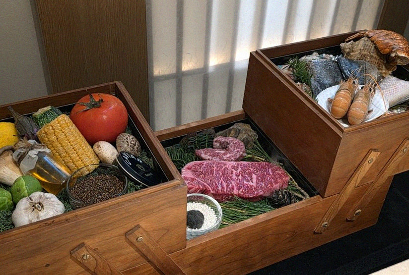 WOOARA Gwanghwamun · the signature Hanwoo showing — marbled beef cuts and caviar presented in a display chest