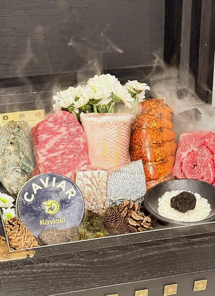GOWOOGA Yeouido · the signature Hanwoo showing — marbled beef cuts and caviar presented in a display chest