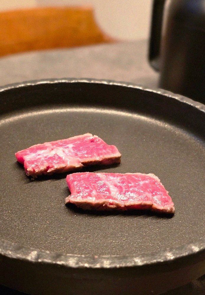 GOWOOGA Yeouido · premium marbled Hanwoo beef presented before grilling