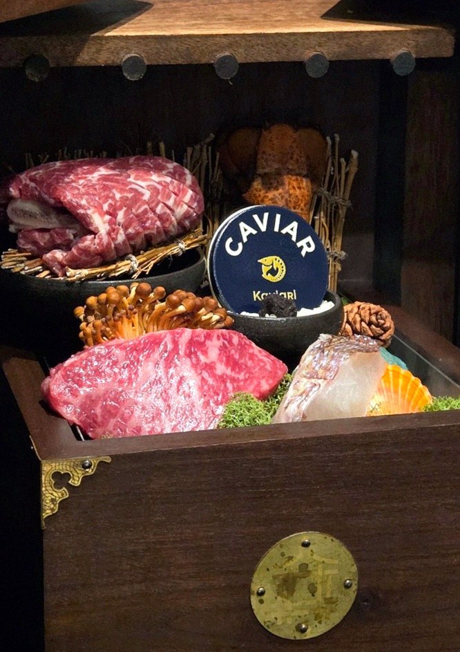 DAEBOJUNG City Hall · the signature Hanwoo showing — marbled beef cuts and caviar presented in a display chest