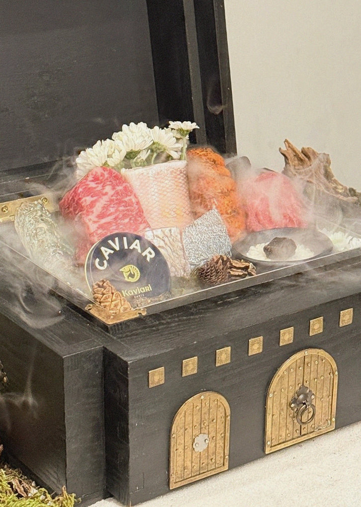GOWOOGA Gwanghwamun · the signature Hanwoo showing — marbled beef cuts and caviar presented in a display chest