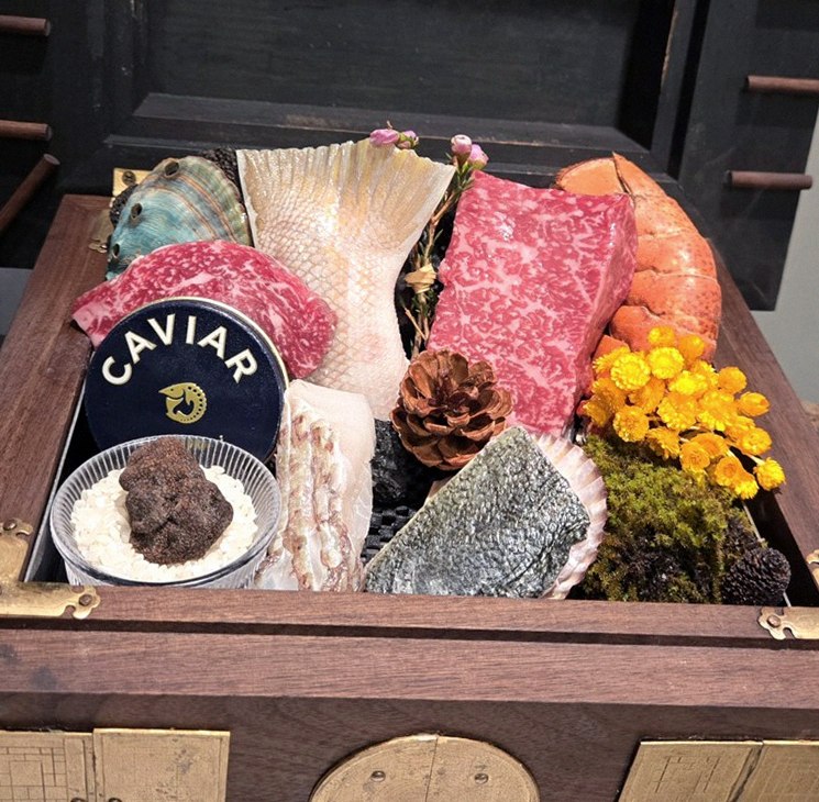 GOWOOGA Gangnam·Yeoksam · the signature Hanwoo showing — marbled beef cuts and caviar presented in a display chest