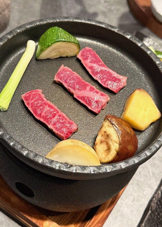 WOOHANA Jonggak · the signature Hanwoo showing — marbled beef cuts and caviar presented in a display chest