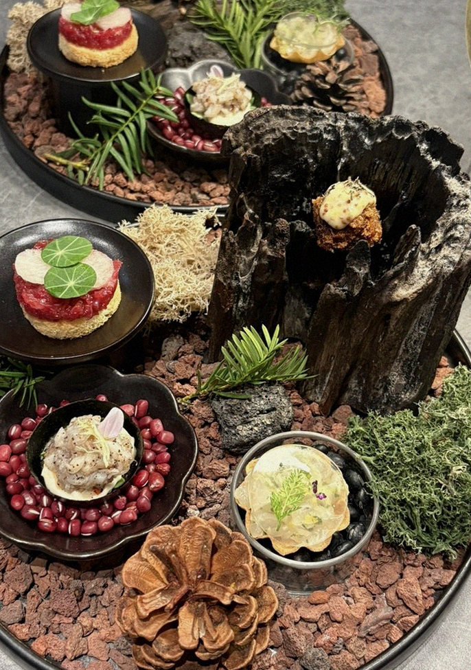 WOOHANA Jonggak · the signature Hanwoo showing — marbled beef cuts and caviar presented in a display chest
