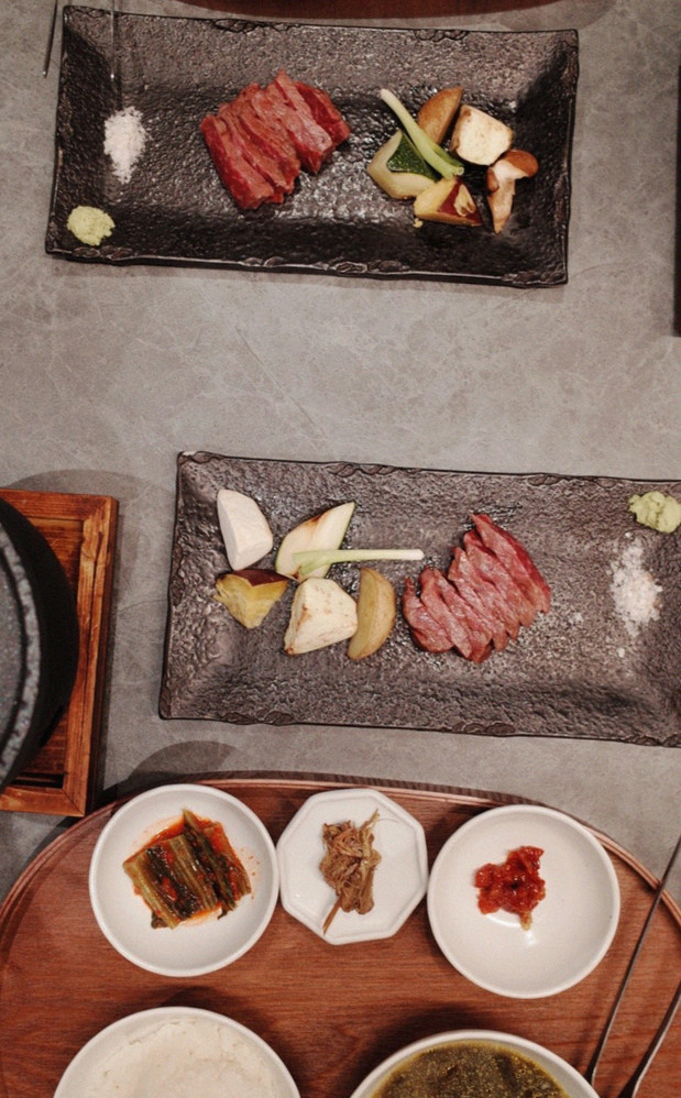 WOOHANA Jonggak · the signature Hanwoo showing — marbled beef cuts and caviar presented in a display chest
