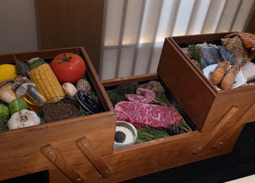 WOOARA Gwanghwamun · the signature Hanwoo showing — marbled beef cuts and caviar presented in a display chest