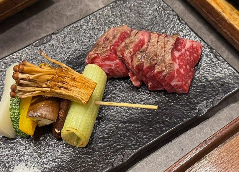GOWOOGA Gwanghwamun · the signature Hanwoo showing — marbled beef cuts and caviar presented in a display chest