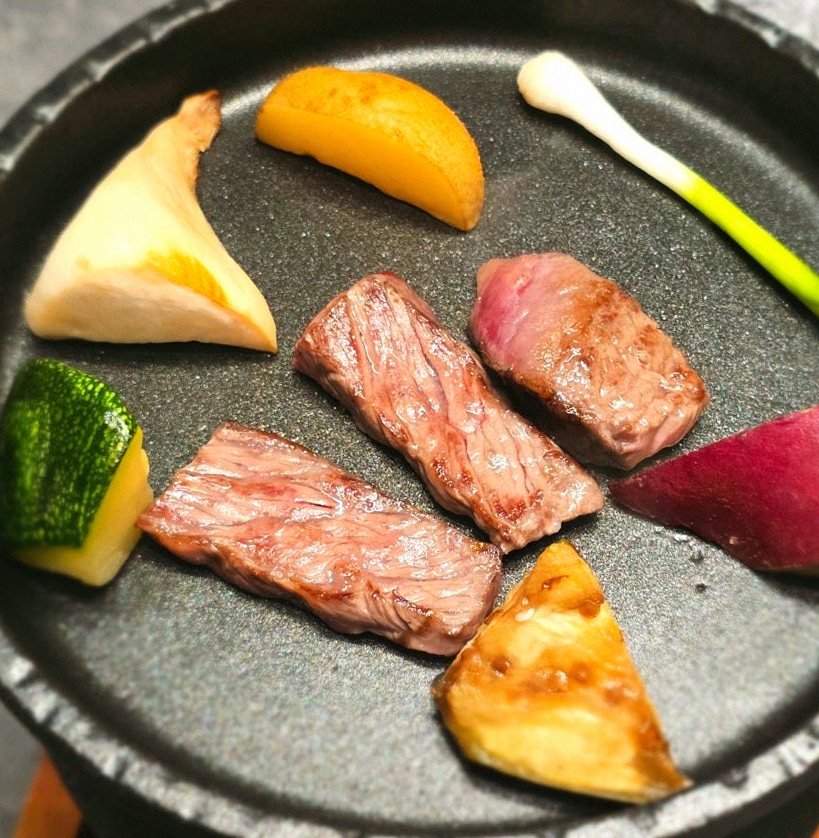 WOOHANA Yeouido · the signature Hanwoo showing — marbled beef cuts and caviar presented in a display chest