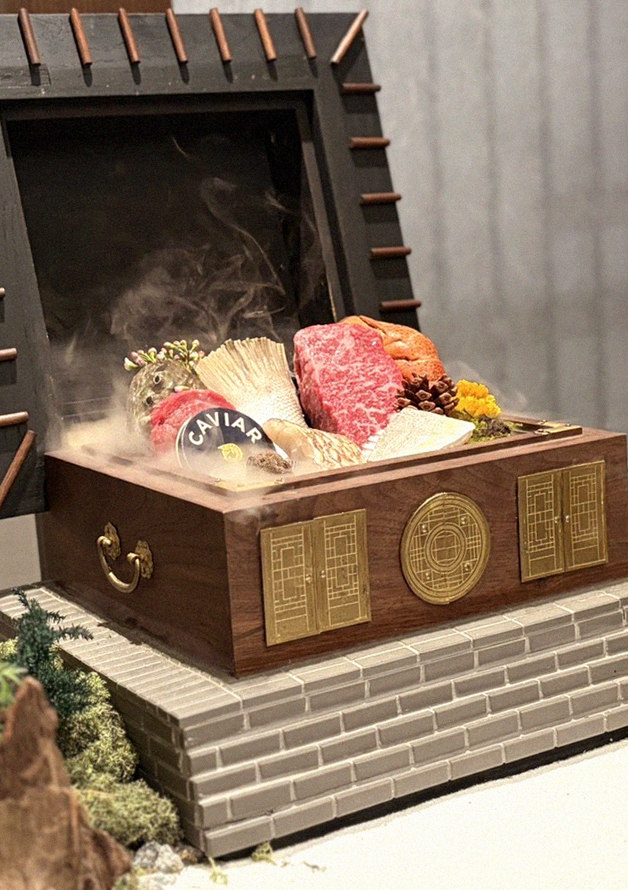 GOWOOGA Gangnam·Yeoksam · the signature Hanwoo showing — marbled beef cuts and caviar presented in a display chest