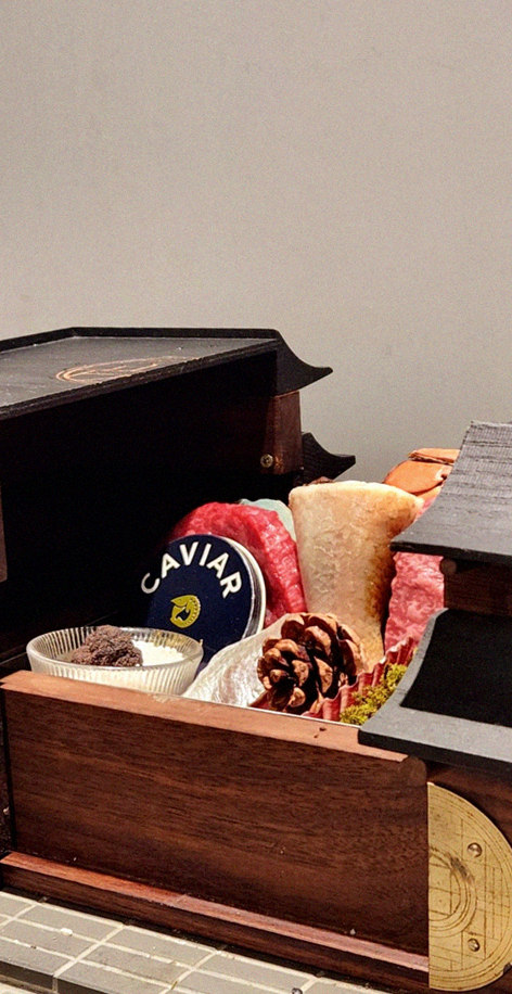 GOWOOGA Gangnam·Yeoksam · the signature Hanwoo showing — marbled beef cuts and caviar presented in a display chest