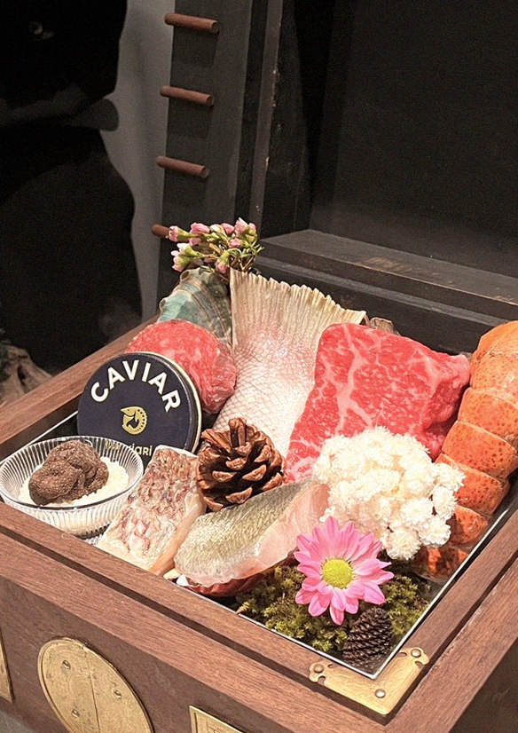GOWOOGA Gangnam·Yeoksam · the signature Hanwoo showing — marbled beef cuts and caviar presented in a display chest