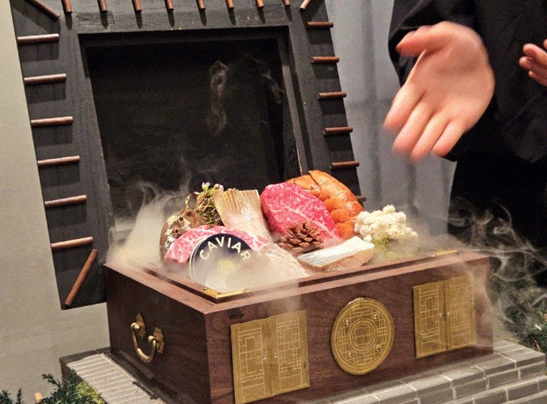 GOWOOGA Gangnam·Yeoksam · the signature Hanwoo showing — marbled beef cuts and caviar presented in a display chest