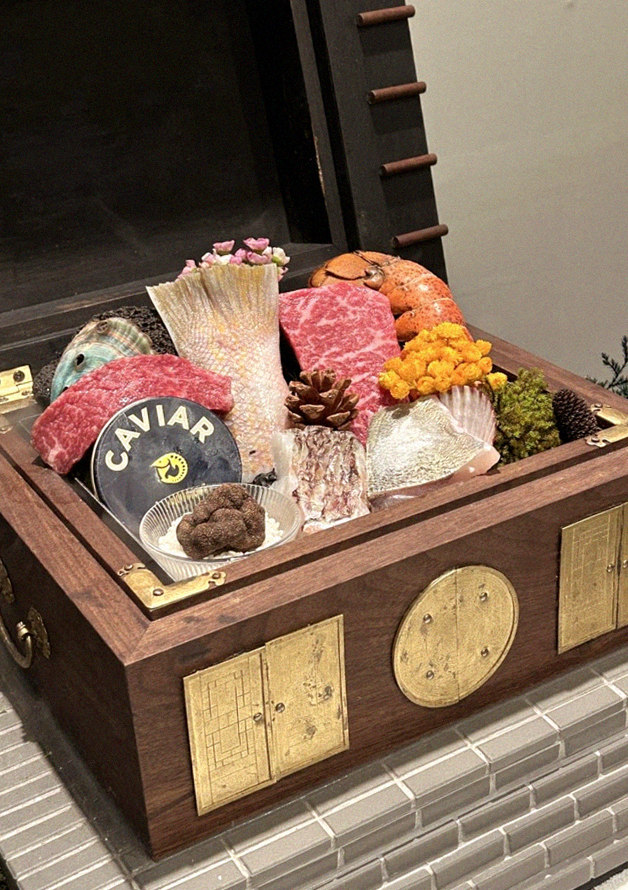 GOWOOGA Gangnam·Yeoksam · the signature Hanwoo showing — marbled beef cuts and caviar presented in a display chest
