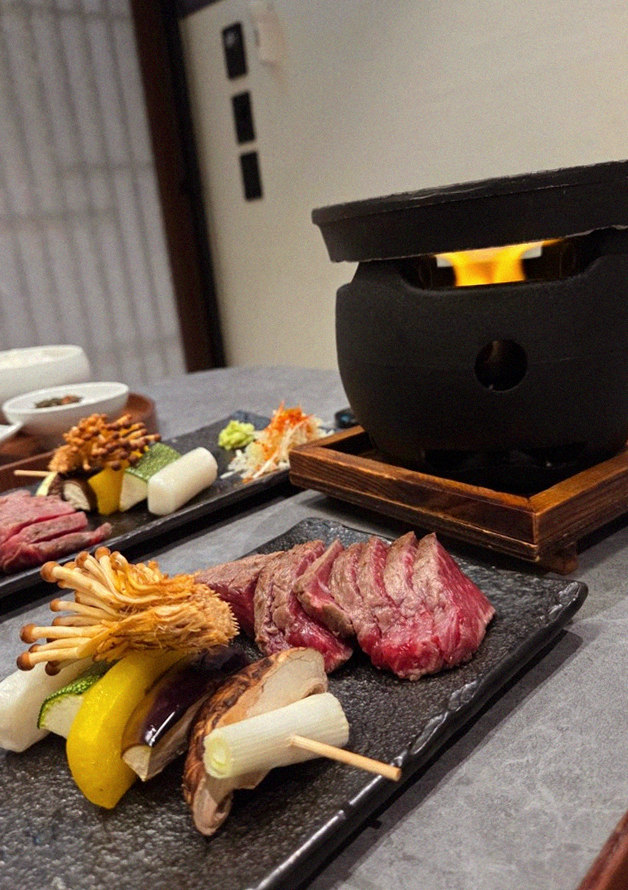 GOWOOGA Gangnam·Yeoksam · the signature Hanwoo showing — marbled beef cuts and caviar presented in a display chest