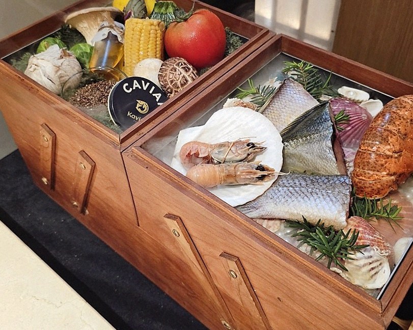 WOOARA Gwanghwamun · the signature Hanwoo showing — marbled beef cuts and caviar presented in a display chest