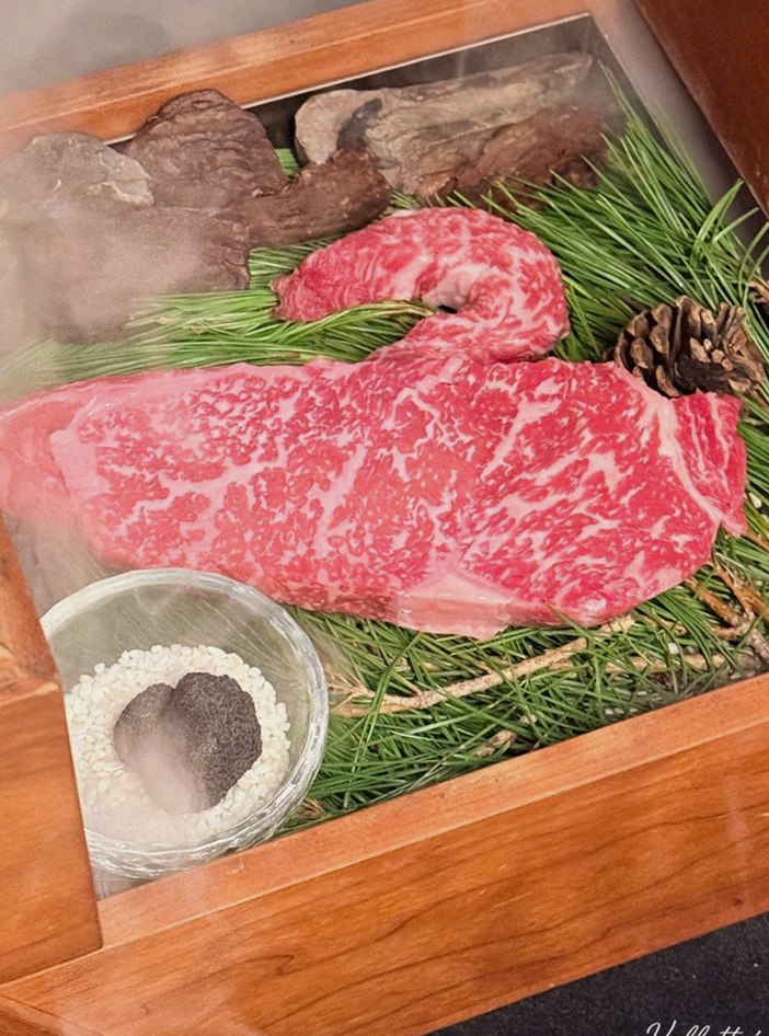 WOOARA Yeouido · the signature Hanwoo showing — marbled beef cuts and caviar presented in a display chest