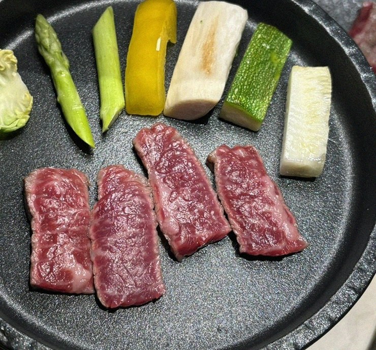 WOOARA Yeouido · premium marbled Hanwoo beef presented before grilling