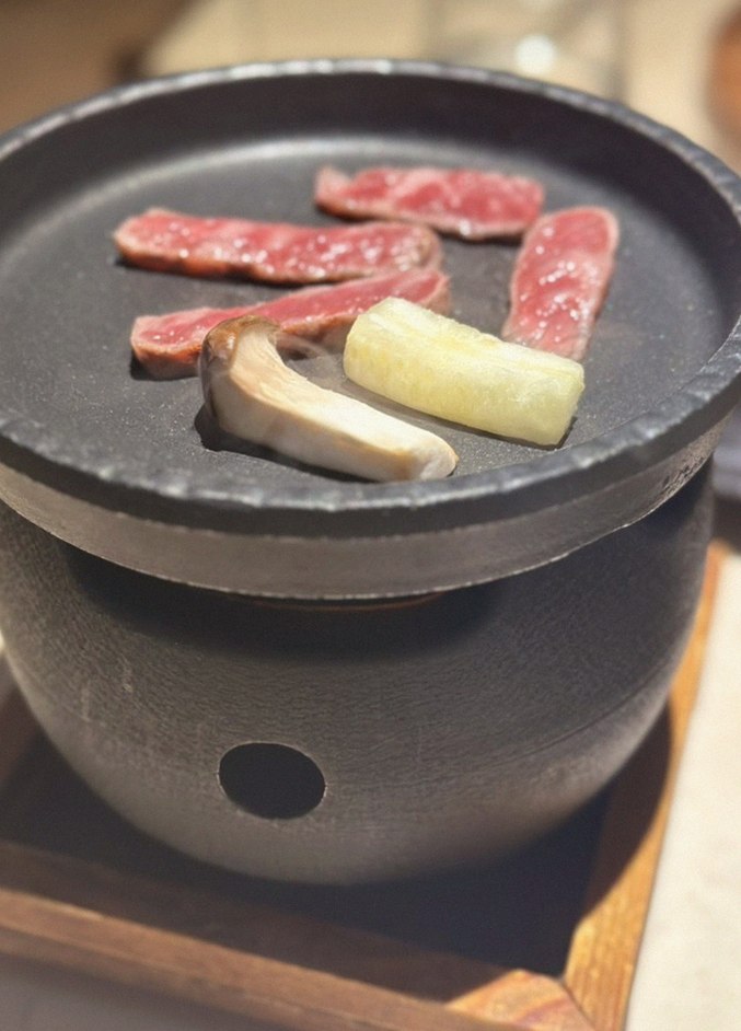 WOOARA Gwanghwamun · the signature Hanwoo showing — marbled beef cuts and caviar presented in a display chest