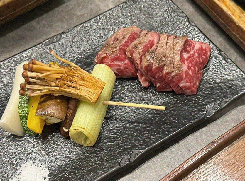 GOWOOGA Gwanghwamun · the signature Hanwoo showing — marbled beef cuts and caviar presented in a display chest