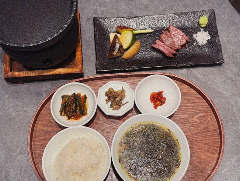 WOOHANA Yeouido · the signature Hanwoo showing — marbled beef cuts and caviar presented in a display chest