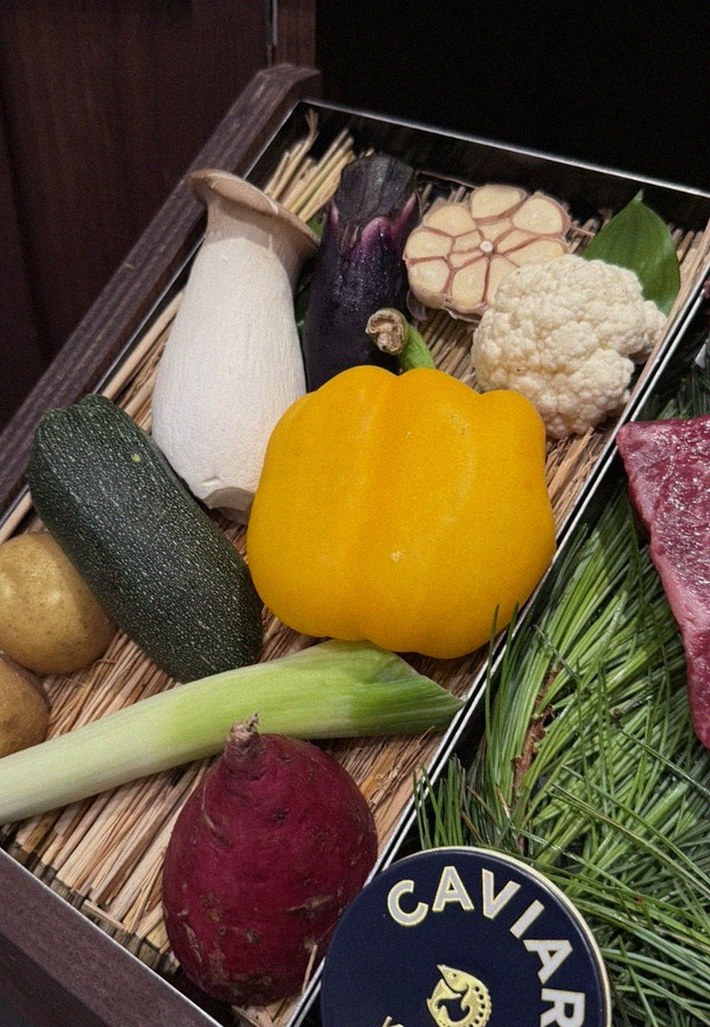 WOOHANA Yeouido · the signature Hanwoo showing — marbled beef cuts and caviar presented in a display chest