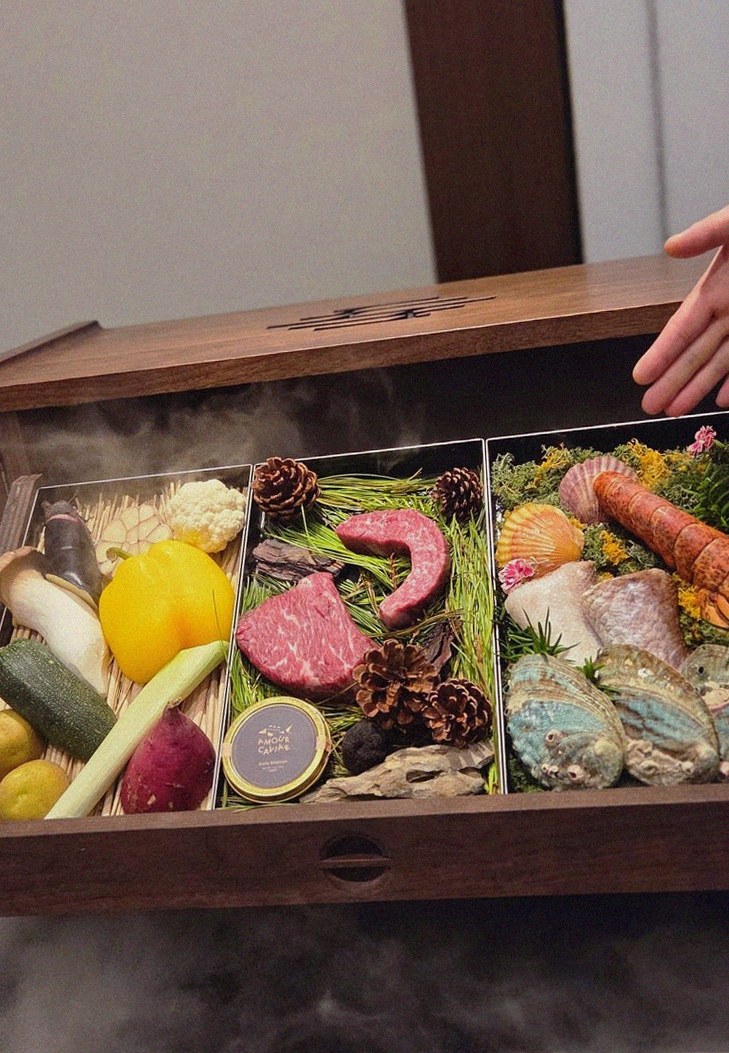 WOOHANA Yeouido · the signature Hanwoo showing — marbled beef cuts and caviar presented in a display chest