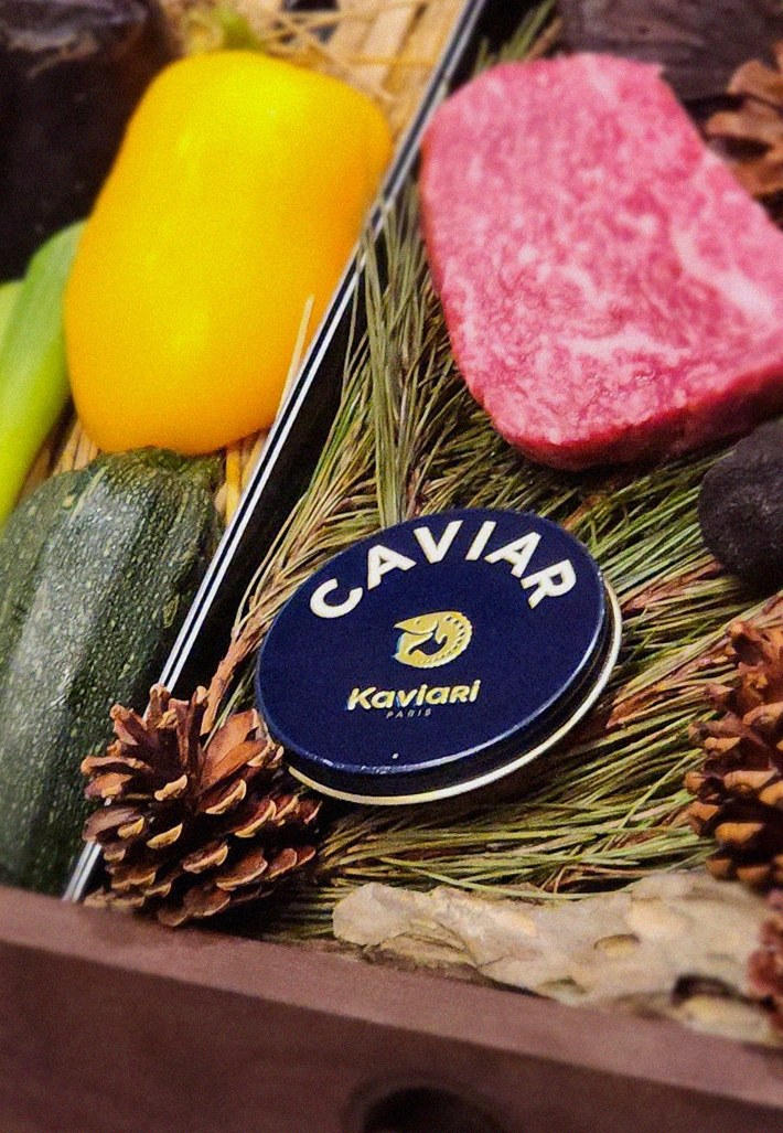 WOOHANA Yeouido · the signature Hanwoo showing — marbled beef cuts and caviar presented in a display chest