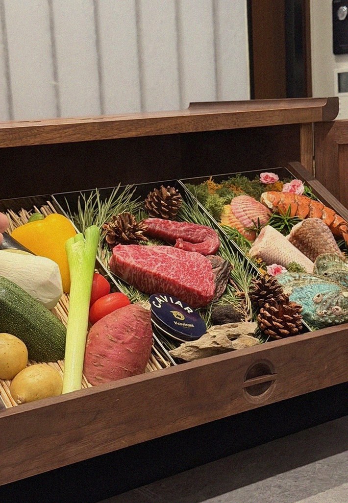 WOOHANA Yeouido · the signature Hanwoo showing — marbled beef cuts and caviar presented in a display chest