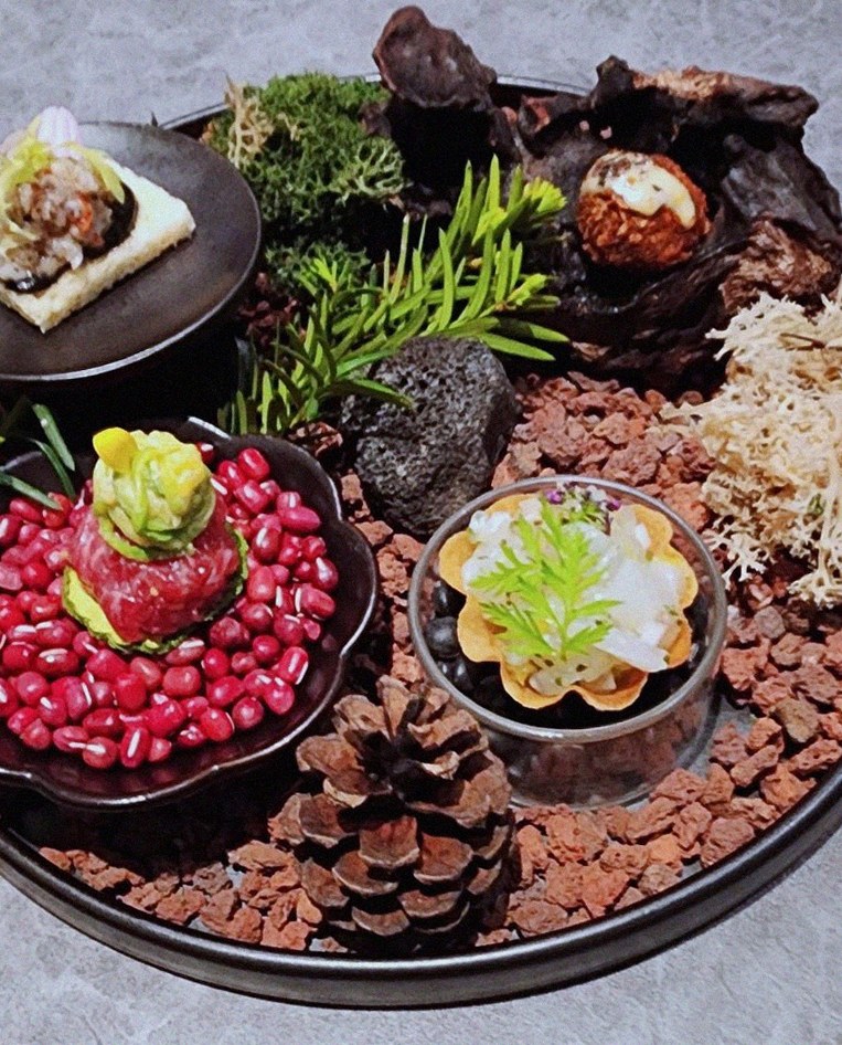 WOOHANA Yeouido · the signature Hanwoo showing — marbled beef cuts and caviar presented in a display chest