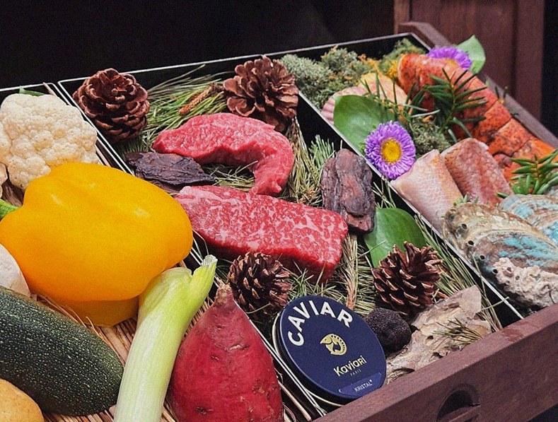 WOOHANA Yeouido · the signature Hanwoo showing — marbled beef cuts and caviar presented in a display chest