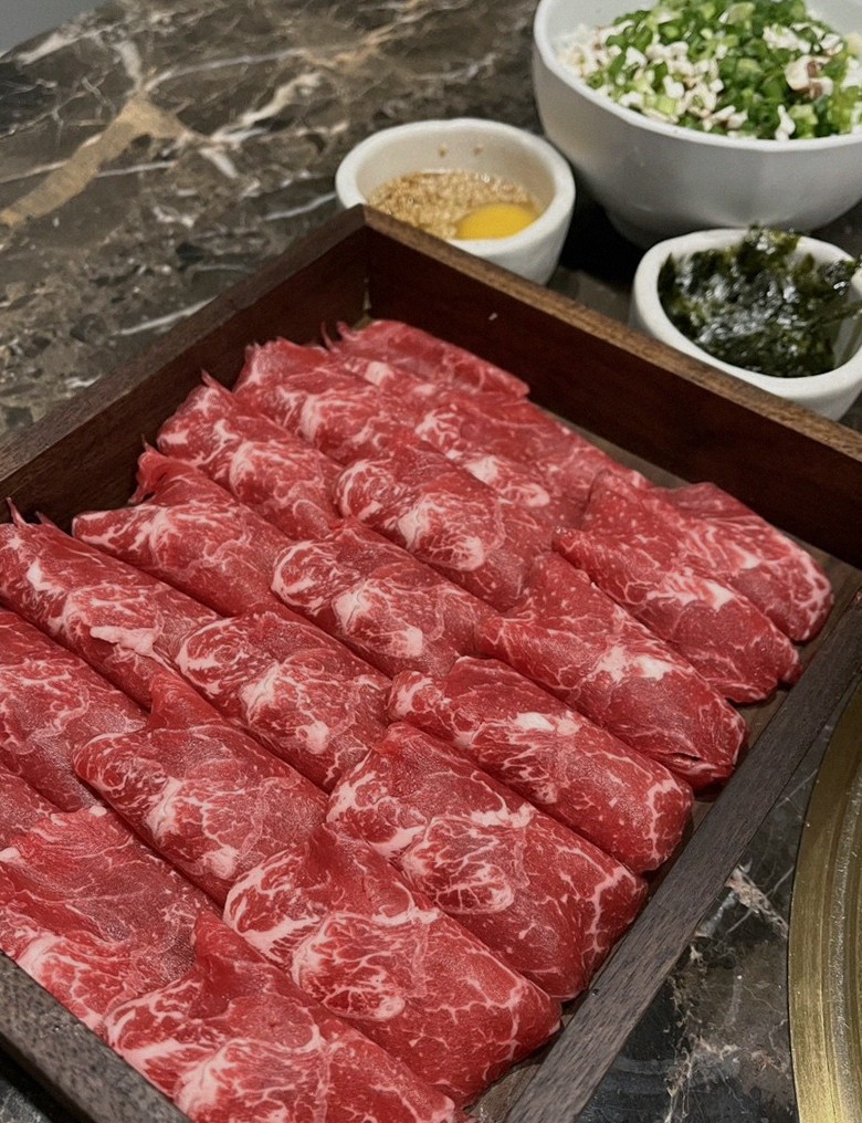 DAEBOJUNG City Hall · premium marbled Hanwoo beef presented before grilling