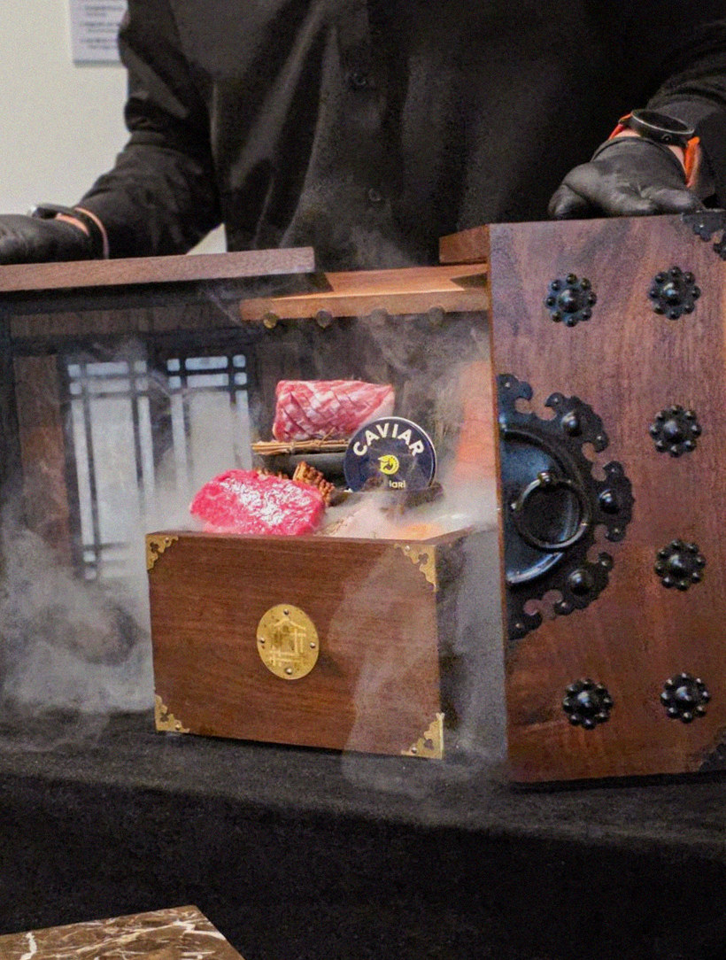 DAEBOJUNG City Hall · the signature Hanwoo showing — marbled beef cuts and caviar presented in a display chest