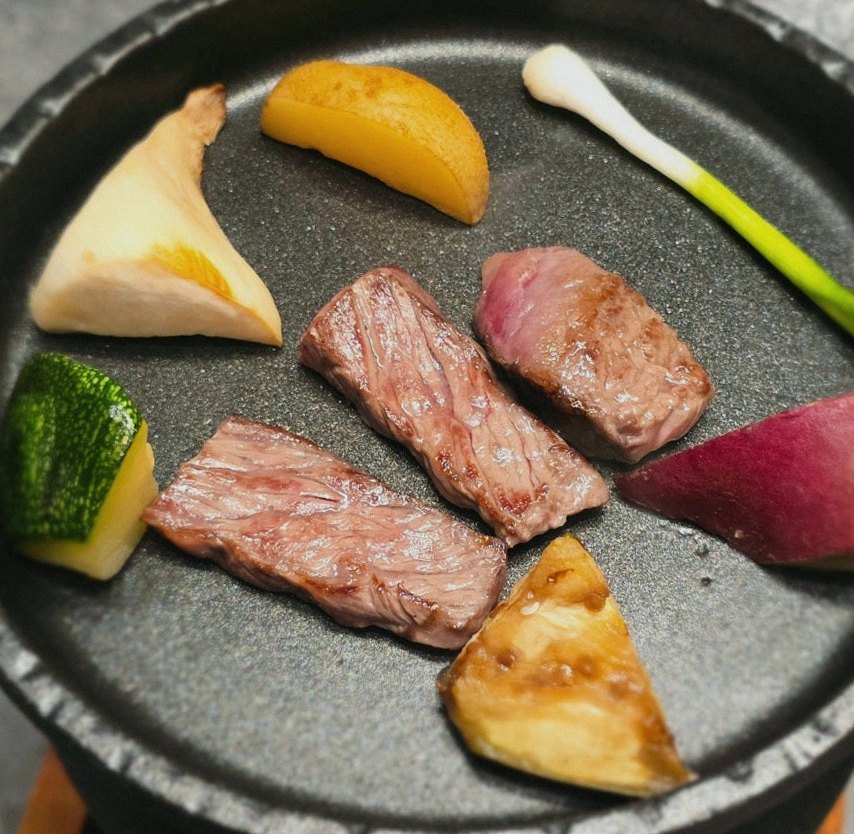 WOOHANA Jonggak · the signature Hanwoo showing — marbled beef cuts and caviar presented in a display chest